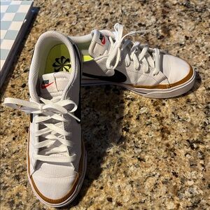 Nike White and Black Sneakers with Tan Accents
Court side